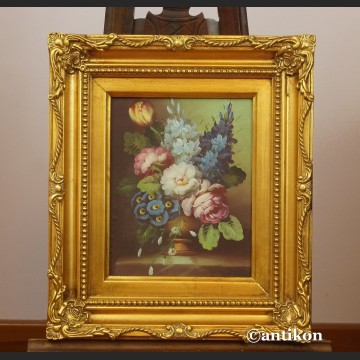 Kwiaty para obrazów z kwiatami w złotej ramie